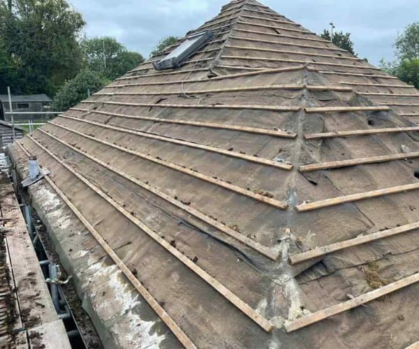 This is a photo of a hip roof that has been stripped back to the battens, and is awaiting a new roof covering to be installed. Works carried out by GKL Roofing Tickhill